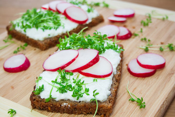 Wholemeal bread sandwiches with cress and radish