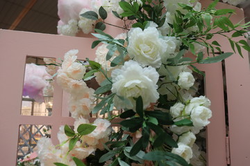 bright photo zone with roses and tulips