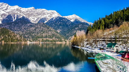 Lake Ritsa in the Caucasus Mountains, in the north-western part of Abkhazia, surrounded by mixed mountain forests and subalpine meadows.