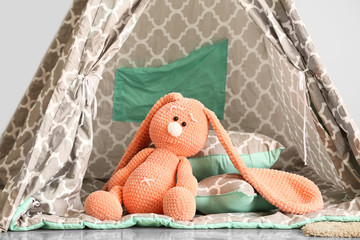 Play tent with cuddly toy in children's room