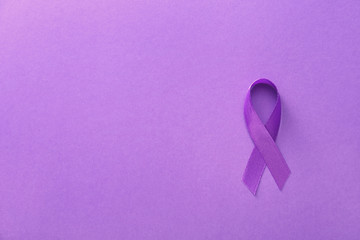 Violet ribbon on color background. Domestic violence concept