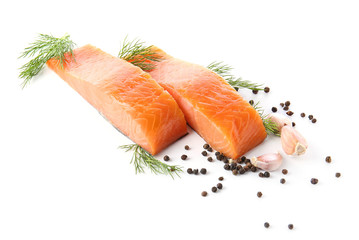 Raw salmon fillet with spices on white background