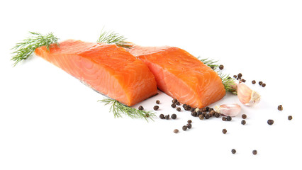 Raw salmon fillet with spices on white background