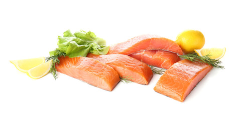 Raw salmon fillet with herbs and lemon on white background
