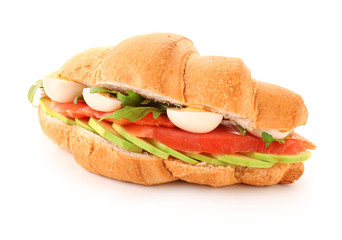 Tasty croissant sandwich on white background