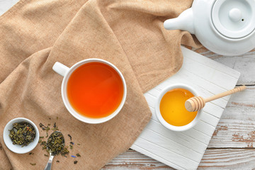 Sweet honey with tea on table