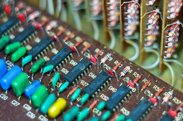 Vintage electronic circuit boards with radio parts and chips, close-up, macro photo