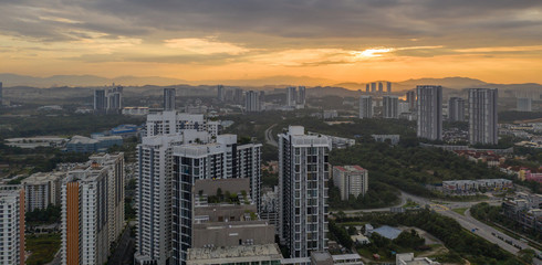 Fototapeta premium Aerial view of apartment buildings in Cyberjaya City, Malaysia at sunrise.