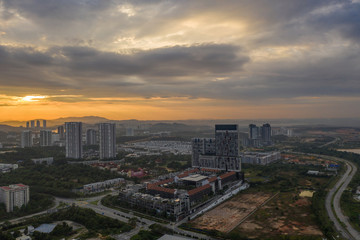 Fototapeta na wymiar Aerial view of apartment buildings in Cyberjaya City, Malaysia at sunrise.