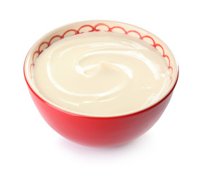 Bowl with tasty cream cheese on white background