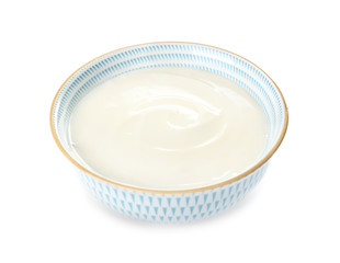 Bowl with tasty cream cheese on white background