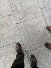 grey granite tiles are laid on the streets of the city