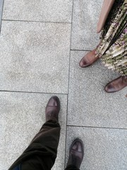 grey granite tiles are laid on the streets of the city