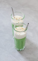 Combined drink spinach smoothies and oatmeal smoothies in a glass