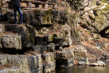 man stands at the edge of the river