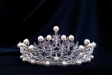 Vintage royal crown with pearls, jewellery. Concept of power and wealth..