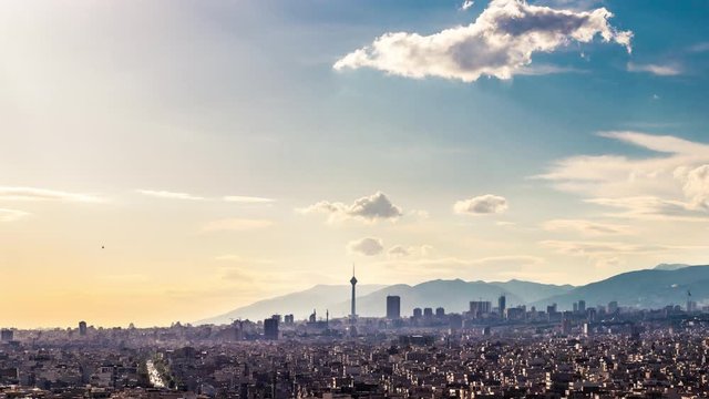 4K time lapse of Tehran skyline at a beautiful sunny day with white clouds, blue sky and Milad tower in frame.