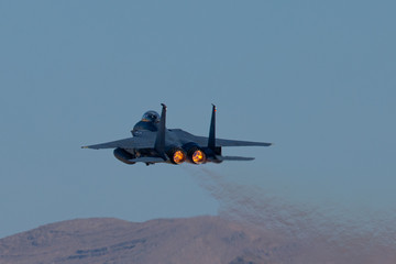 Very close tail view of a F15 Eagle with afterburner on