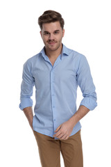 Fototapeta premium Positive casual man smiling with his hand in his pocket
