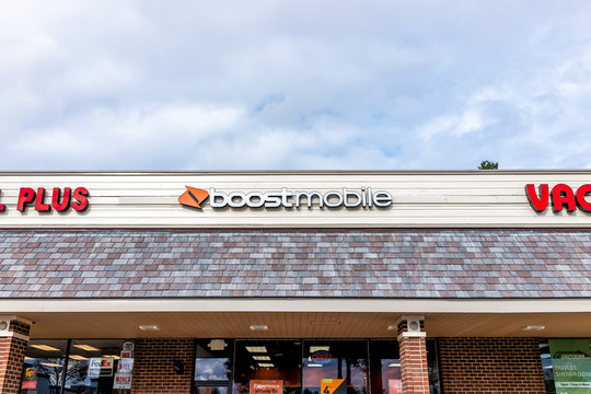 Herndon, USA - November 12, 2019: Exterior of Boost Mobile store on street in Virginia Fairfax County with sign and entrance
