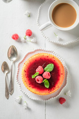 Yummy and sweet raspberry cheesecake with red jelly