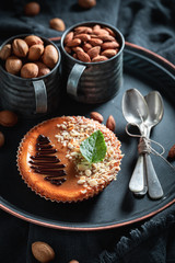Sweet and tasty almond cheesecake made nuts and chocolate