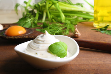 mayonnaise sauce on a wooden background cooking