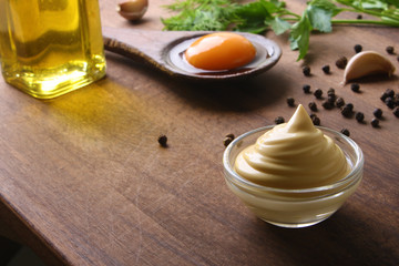 mayonnaise sauce on a wooden background cooking