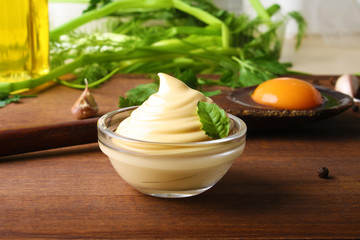mayonnaise sauce on a wooden background cooking