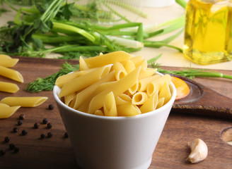 Penne rigate. Macaroni in the form of feathers. mostaccioli pasta