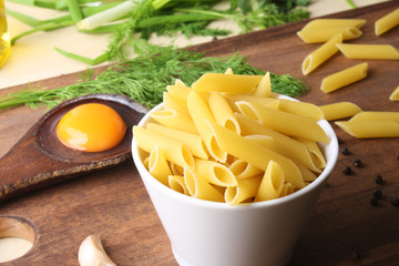 Penne rigate. Macaroni in the form of feathers. mostaccioli pasta