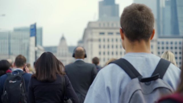 Crowd of pedestrian commuters in London on cool morning in slow motion. Clip 30a