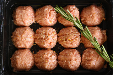 meatball forcemeat beef pork on wooden background rosemary