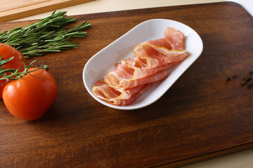 bacon sliced on a wooden background