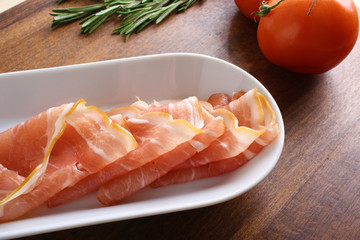 bacon sliced on a wooden background