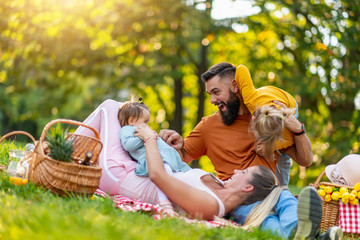 Joyful family picnicking in the park