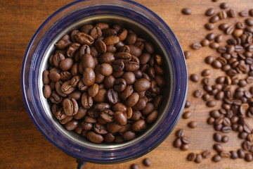 coffee beans in an electric coffee grinder