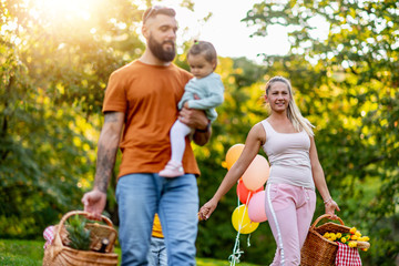 Joyful family picnicking in the park