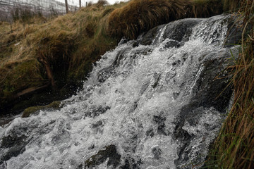 Small river cascade, Frozen motion, natural abstract texture background.