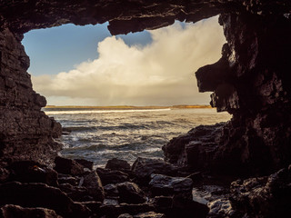 View on Atlantic ocean from a cave by Rosses point beach in county Sligo Ireland,