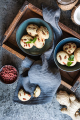 Coconut and ginger cookies topped with goji berry