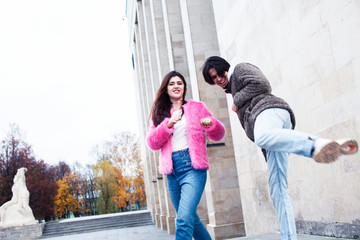 young happy students teenagers at university building on stairs, lifestyle people concept boy and girl