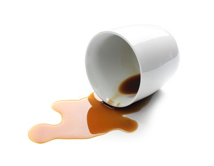 Overturned cup and spilled coffee on white background
