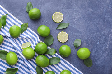 Fresh limes on color background