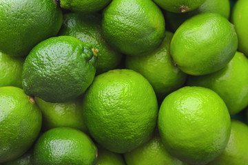 Many fresh limes as background
