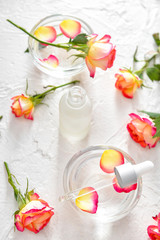 Fototapeta na wymiar Rose essential oil on white background
