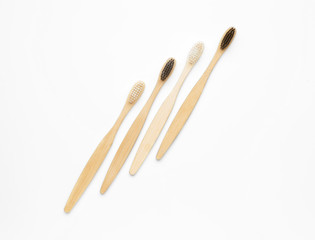 Wooden tooth brushes on white background
