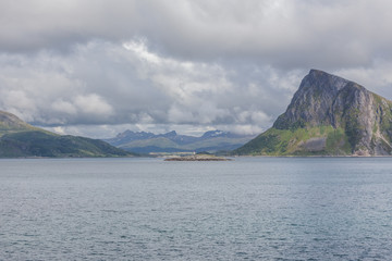 End of fjord. Beautiful Norwegian landscape. view of the fjords. Norway ideal fjord reflection in clear water In cloudy weather. selective focus
