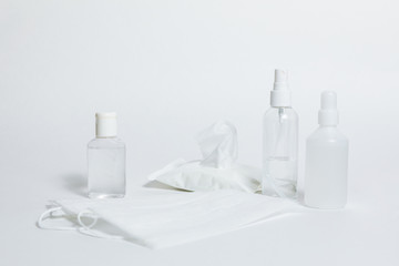Antiseptic gel, sanitary napkins, medical  mask, antibacterial spray on a white background.  Personal protective hygiene concept.  Prevention of coronavirus disease (COVID-19)