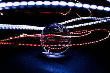 Crystal sphere light painting. Colorful energy trails